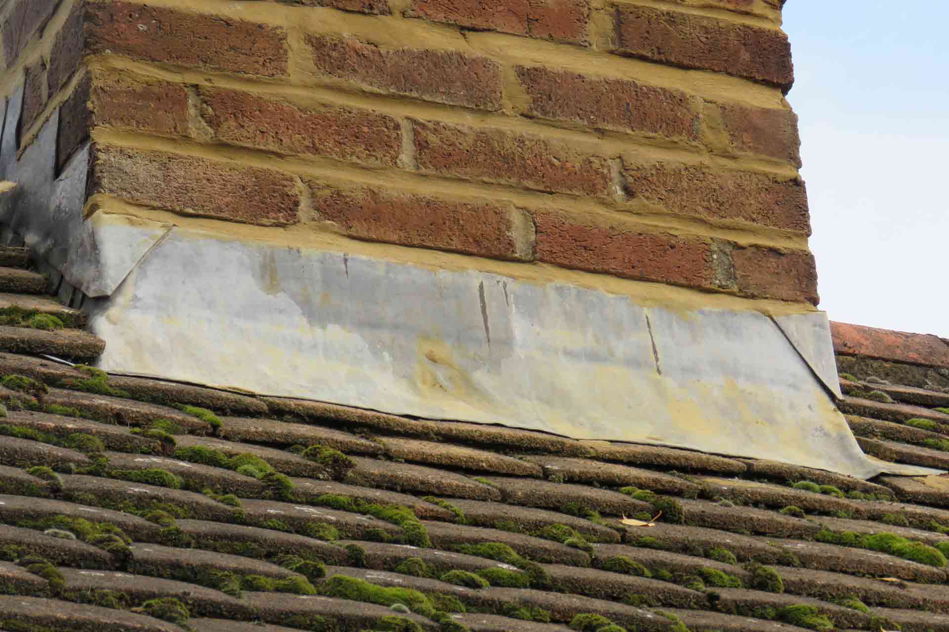Lead flashing repair around chimney and abutment